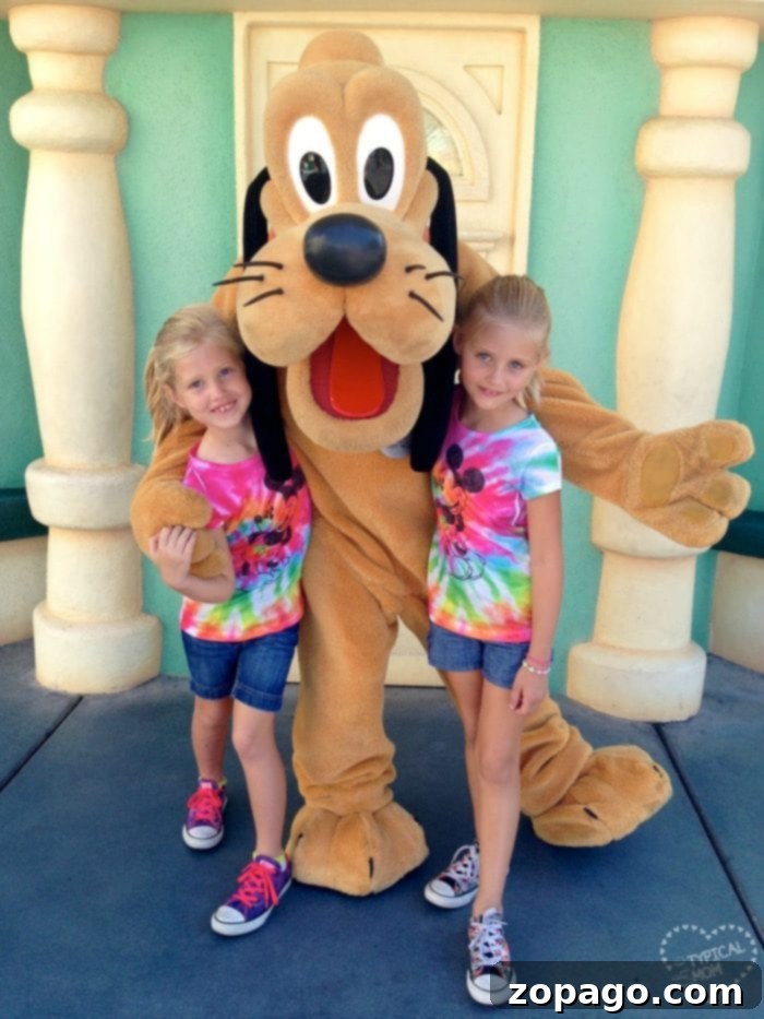 Best vacation spots for kids! Here is where you should take them while they''re still young, our top 10 favorite vacations with kids. #vacation #withkids #travel #familytravel A child embracing a beloved Disney character, symbolizing the magical experience of Disneyland for families.
