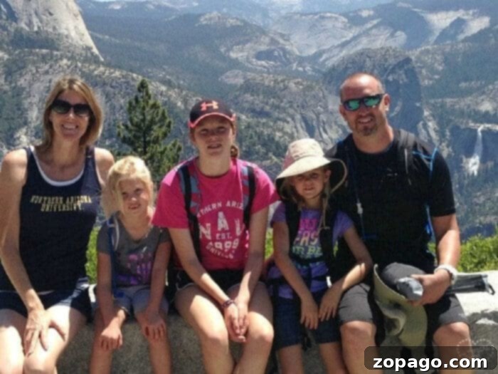 Best vacation spots for kids! Here is where you should take them while they''re still young, our top 10 favorite vacations with kids. #vacation #withkids #travel #familytravel A family hiking through Yosemite National Park, surrounded by majestic natural beauty, embodying the spirit of kid-friendly adventure.