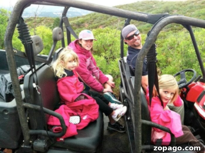 Best vacation spots for kids! Here is where you should take them while they''re still young, our top 10 favorite vacations with kids. #vacation #withkids #travel #familytravel A family enjoying the scenic tram ride through Zion National Park, highlighting a kid-friendly national park experience.