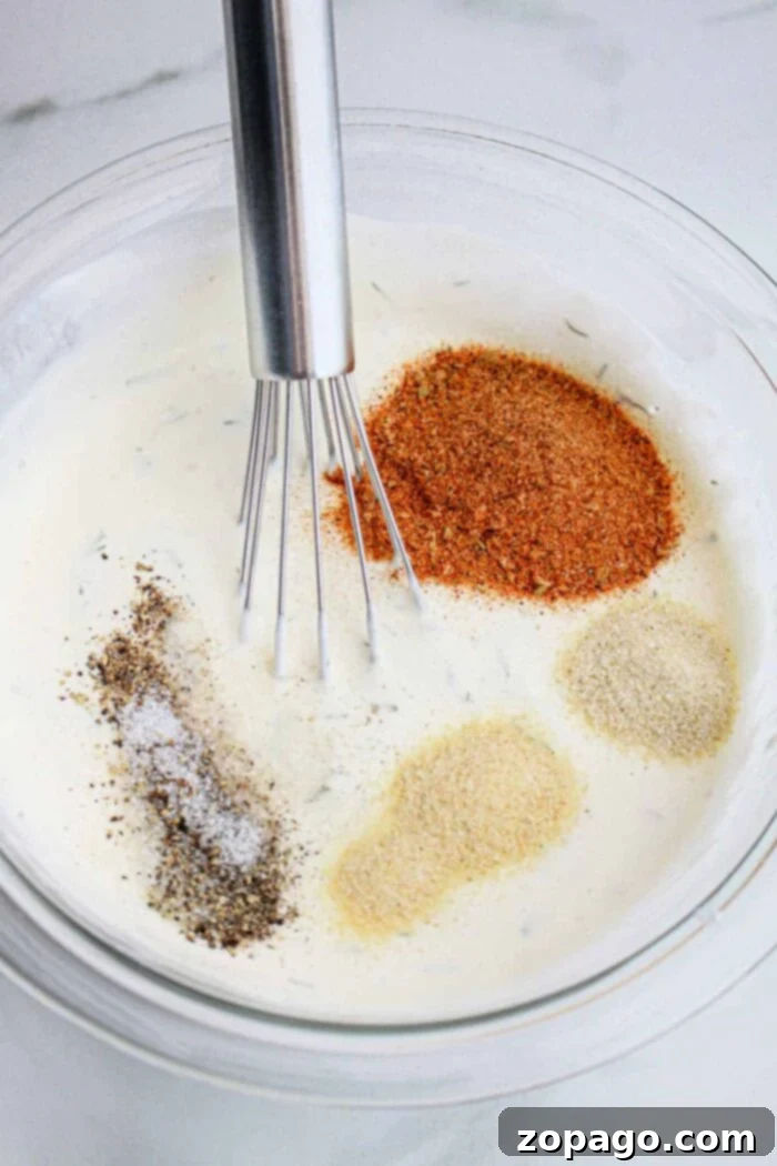 Popeyes Copycat Blackened Ranch Sauce Recipe 6 Serving homemade Blackened Ranch alongside chicken and fries