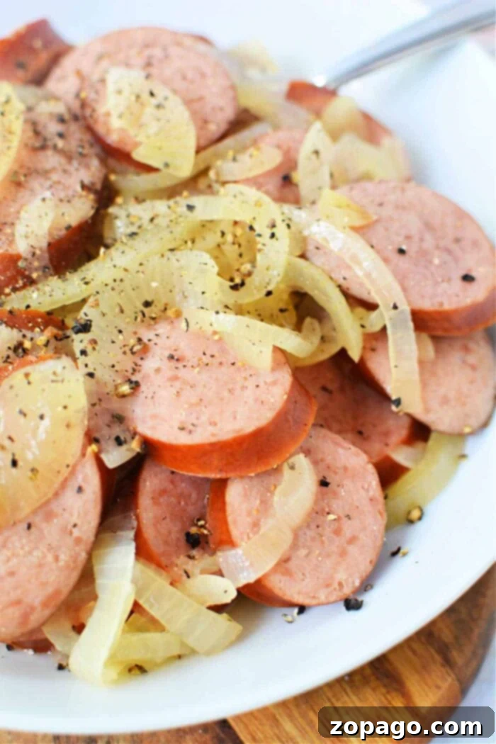 Set It and Forget It Kielbasa 2 Flavorful Kielbasa in Crock Pot with tender, savory onions