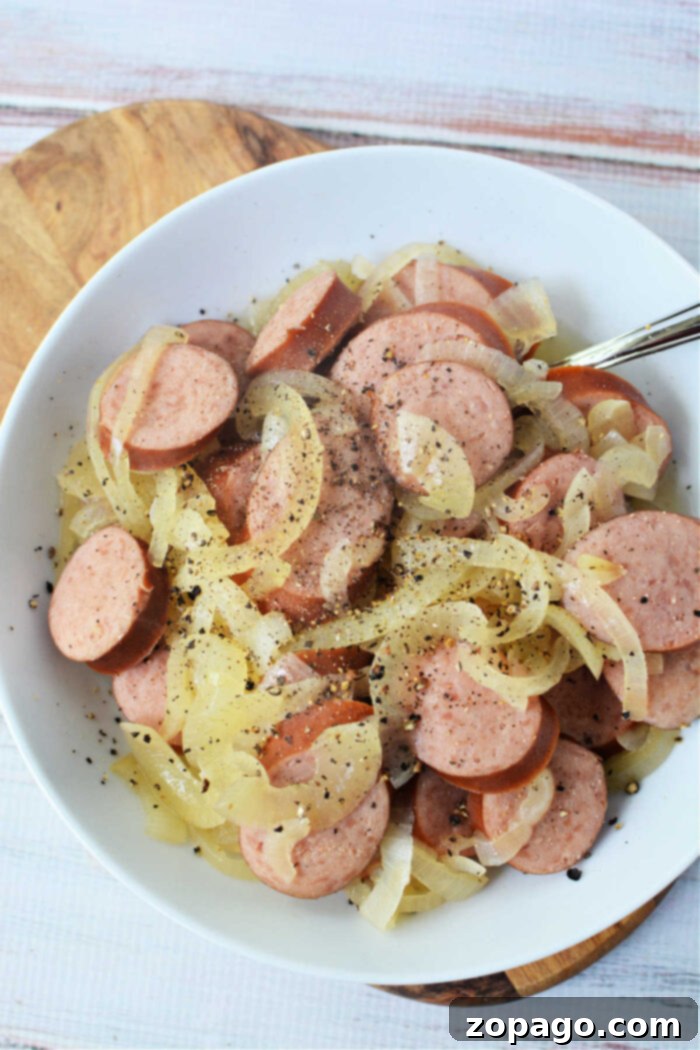 Set It and Forget It Kielbasa 7 Hearty kielbasa and onions recipe, slow-cooked to perfection