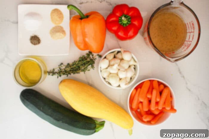 Effortless Slow Cooker Vegetables 3 An assortment of ingredients for slow cooker vegetables are laid out on a light-colored surface. These include a yellow squash, zucchini, baby carrots, a small bowl of garlic cloves, red and orange bell peppers, fresh thyme, olive oil, seasoning mix, and a measuring cup with broth.