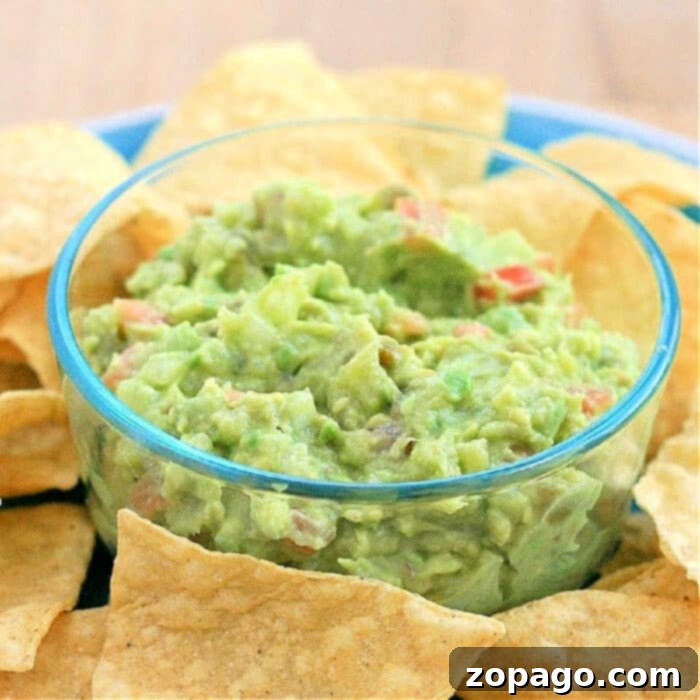 Discover two of the best guacamole recipe dips here, made with diced onion, salsa, and our secret ingredient: fruit! You absolutely must try our pineapple guacamole or add a touch of diced apple for a perfect salty-sweet dip with chips or pretzels. #guacamole #dip #pineapple 4 Ingredient Guacamole Recipe
