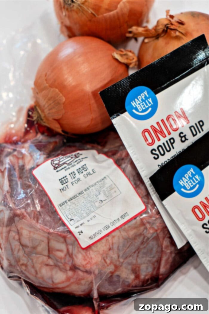 Slow-Cooked Pot Roast with Caramelized Onions 3 A delicious blend of packaged beef tip roast and savory onion soup mix packets, complemented by fresh onions, awaits on the kitchen counter.