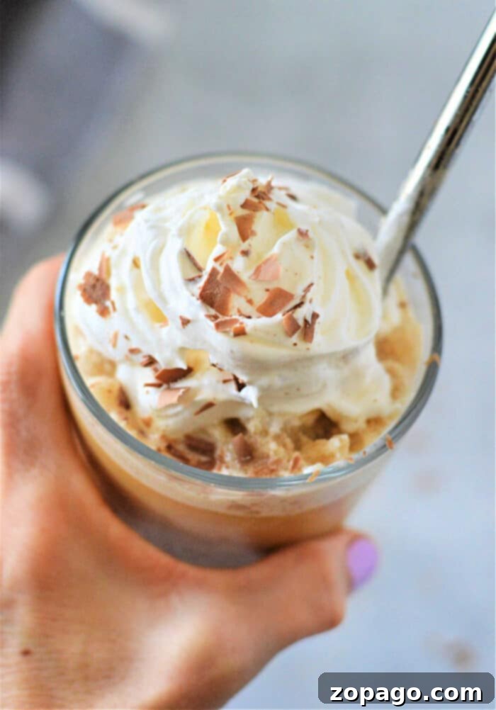 Creamy Pumpkin Spice Blend 2 Delicious Homemade Pumpkin Spice Frappuccino with whipped cream and a metal straw