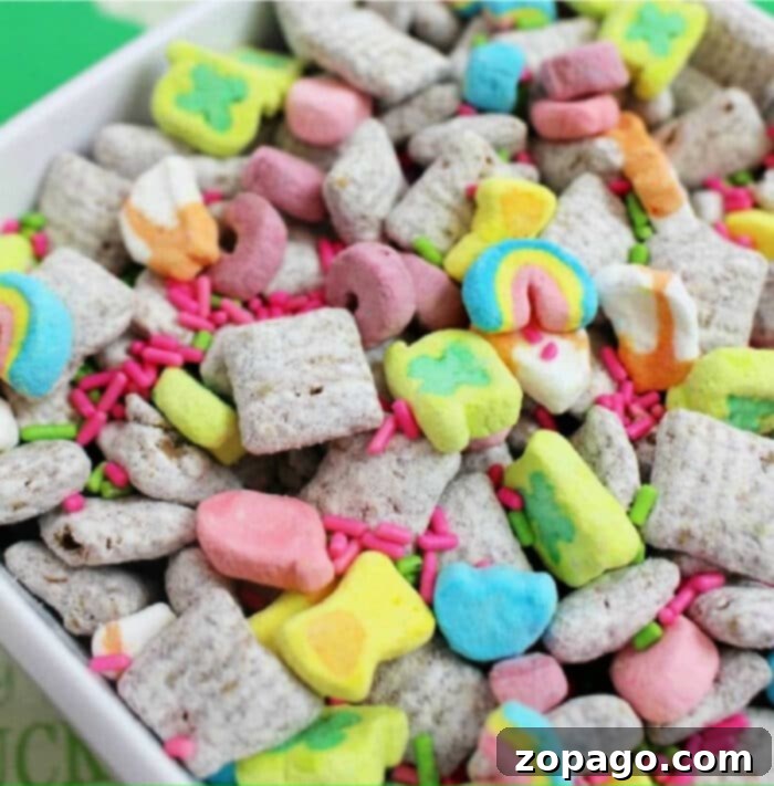 Irresistible Chex Muddy Buddies 7 An overhead shot of a festive chex mix muddy buddies recipe with colorful sprinkles.