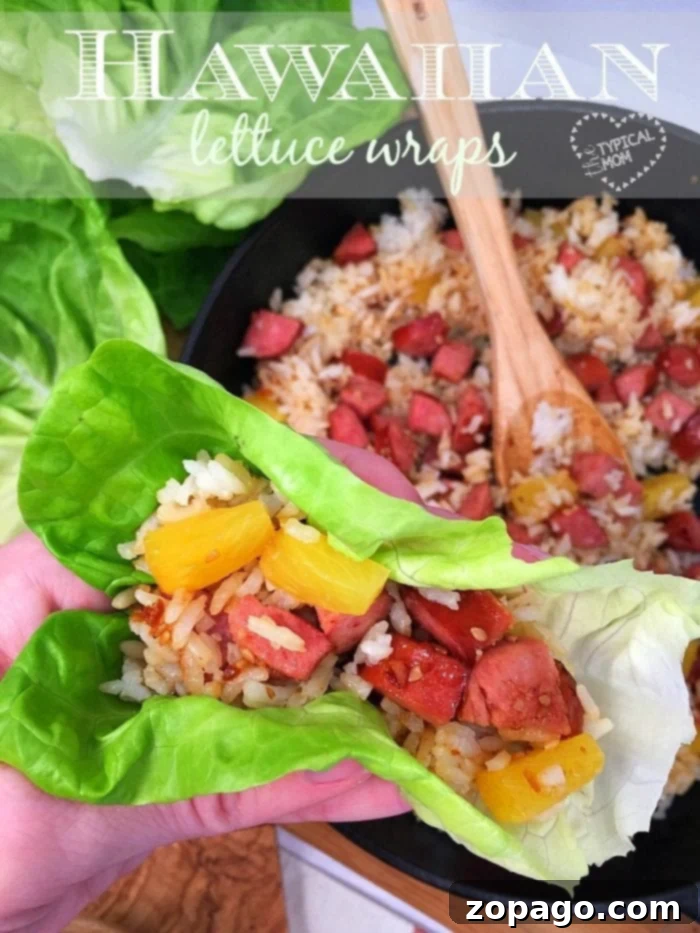 Delicious and easy Hawaiian lettuce wraps with kielbasa and pineapple, ready to serve. Freshly prepared Hawaiian lettuce wraps filled with savory kielbasa and sweet pineapple.