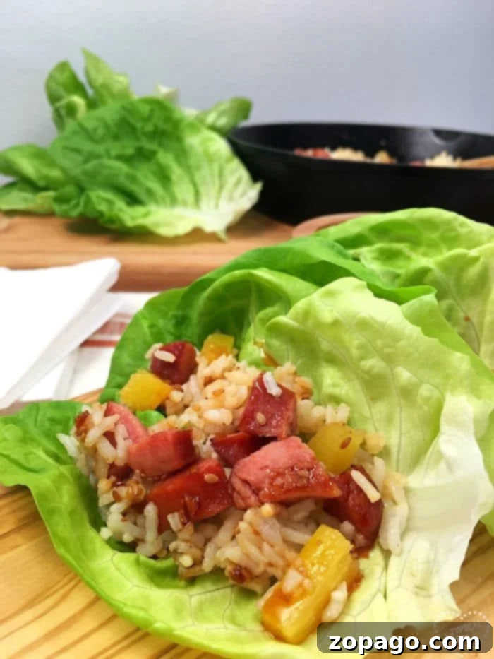 Irresistible Hawaiian lettuce wraps, a simple and healthy meal. Stacked Hawaiian lettuce wraps on a plate, ready to be enjoyed.