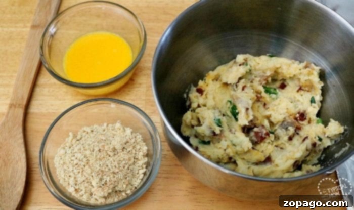 Potato cake recipe that's a perfect side dish for Easter, Thanksgiving or Christmas. They taste incredible and already portioned out for you. #potato #cakes #mashed #easy #potatocakes Easy potato cakes ready to be fried to golden perfection.