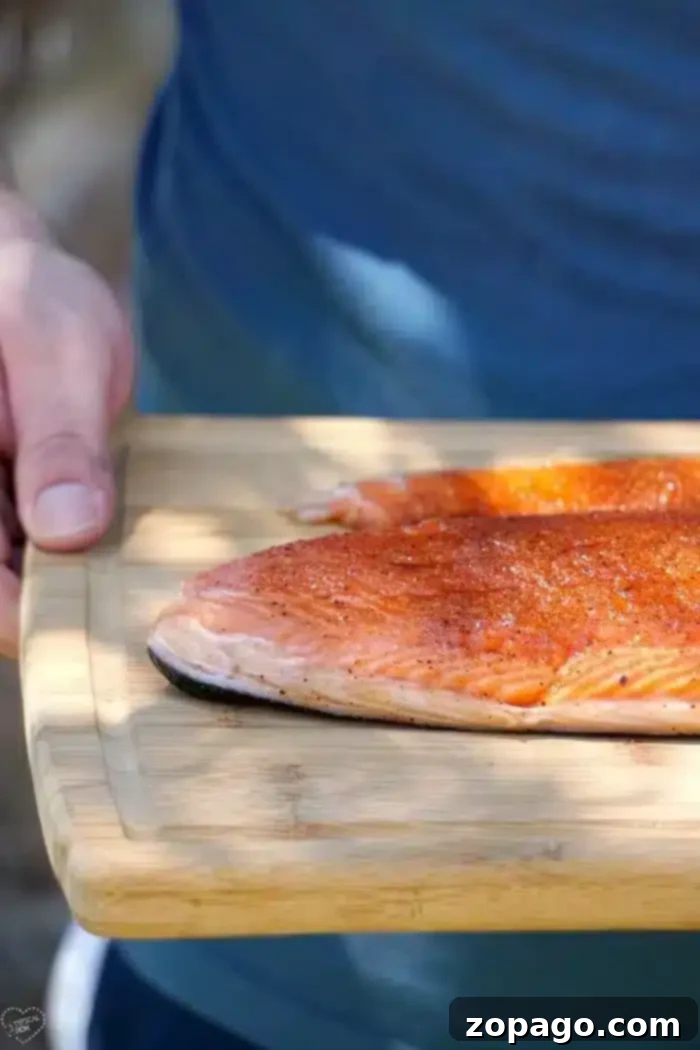 How to smoke salmon in your smoker right at home! The best rub for fish you will ever make that brings out the flavor and makes it melt in your mouth good. Easy recipe for those who have never smoked fish or looking for something new. Healthy and delicious dinner idea. #salmon #fish #smoke #smoker #smokedsalmon #thetypicalmom #smokedfish smoked salmon