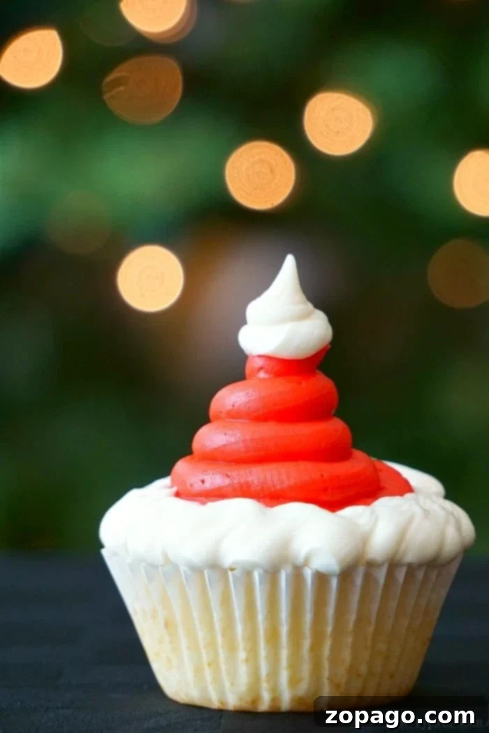 Santa cupcakes are fun and easy to make at Christmas! Find these and how to make Christmas tree cupcakes too here. Fun holiday activities for kids solved. #santa #santaclaus #christmas #cupcakes #dessert Santa hat cupcakes are fun and easy to make at Christmas! Find these and how to make Christmas tree cupcakes too here. Fun holiday activities for kids solved. #santa #santaclaus #christmas #cupcakes #dessert