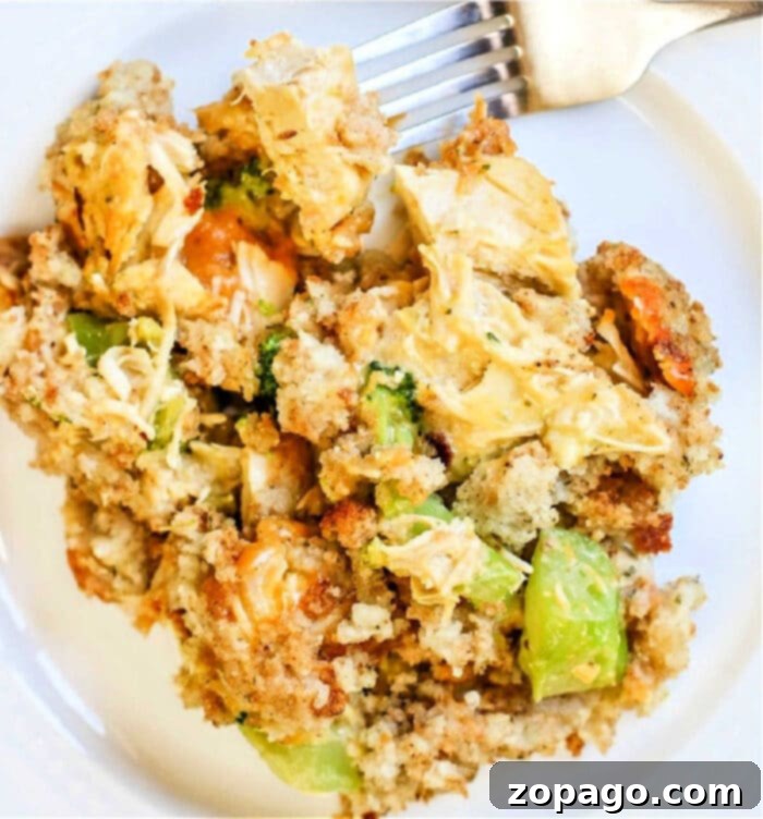 Cheesy Chicken Stuffing Bake 2 A delicious cheesy chicken stuffing casserole with broccoli, ready to be served from a baking dish.
