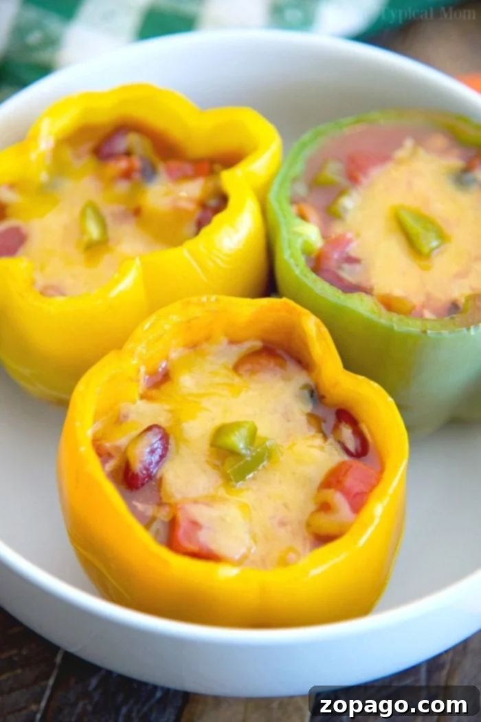 Chili Stuffed Bell Peppers: A simple, healthy, and kid-friendly dinner using leftover chili or canned varieties. Delicious and healthy chili stuffed bell peppers recipe, perfect for using leftover chili for dinner.