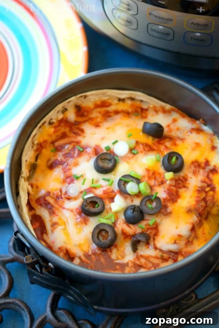 Instant Pot Mexican pizza is amazing!! With layers and layers of cheese, sauce and ground turkey it's like a wonderful enchilada lasagna! #instantpot #mexicanpizza #pizza #pressurecooker #instantpotrecipes #thetypicalmom instant pot mexican pizza 2