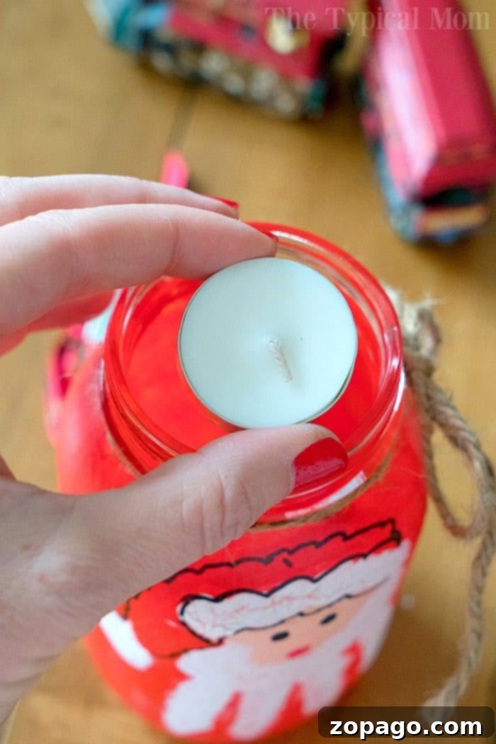 A memorable Santa handprint craft on a mason jar, perfect for kids' Christmas activities or a handmade gift. Capture the magic of their tiny hands. #santa #handprint #christmas #craft #masonjar #gift Close-up of Santa Handprint Craft on Mason Jar