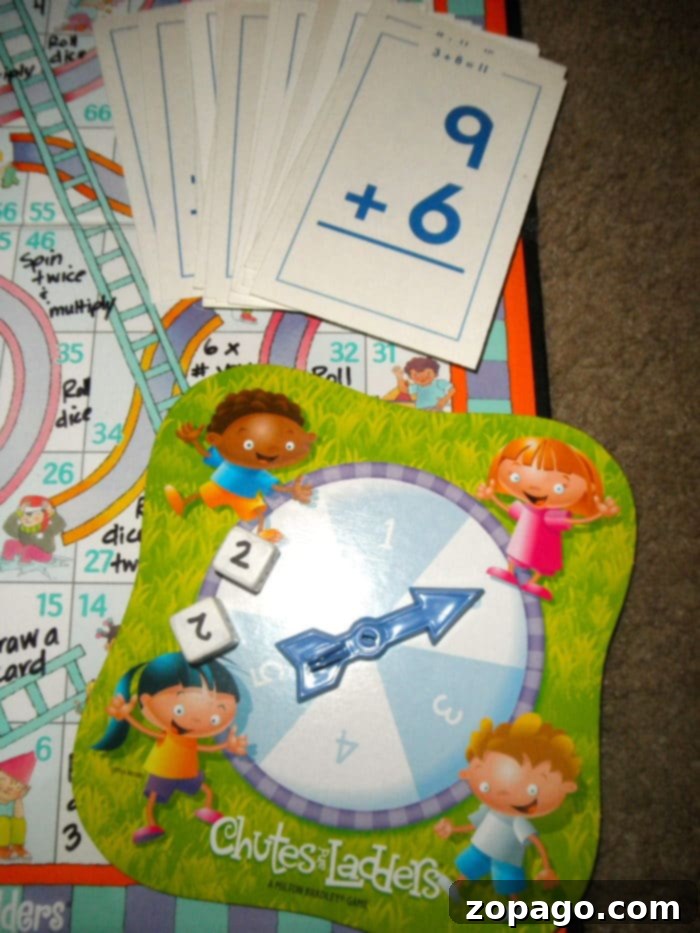 Easy-to-make, inexpensive, and fun DIY math fact games for practicing flashcards. Excellent for addition, subtraction, or multiplication practice at home. A custom DIY math game board with flashcards and dice set up for play