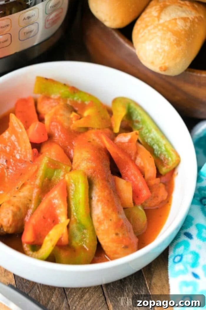 Pressure cooker sausage and peppers is under $10 and feeds 5 people! You only need just 3 ingredients too! #instantpot #pressurecooker #sausage #peppers #instantpotrecipes #thetypicalmom #ninjafoodi Pressure-Cooker-Sausage
