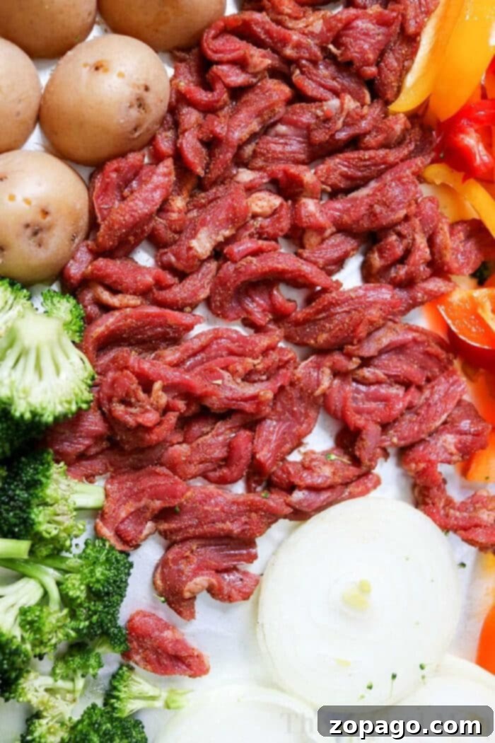 Sheet pan fajitas are yummy and a quick meal for your family tonight. A low carb dinner packed with flavor and vegetables it's sure to become a fave. #sheetpan #dinners #fajitas #beef #steak #lowcarb #keto #healthy sheet-pan-fajitas