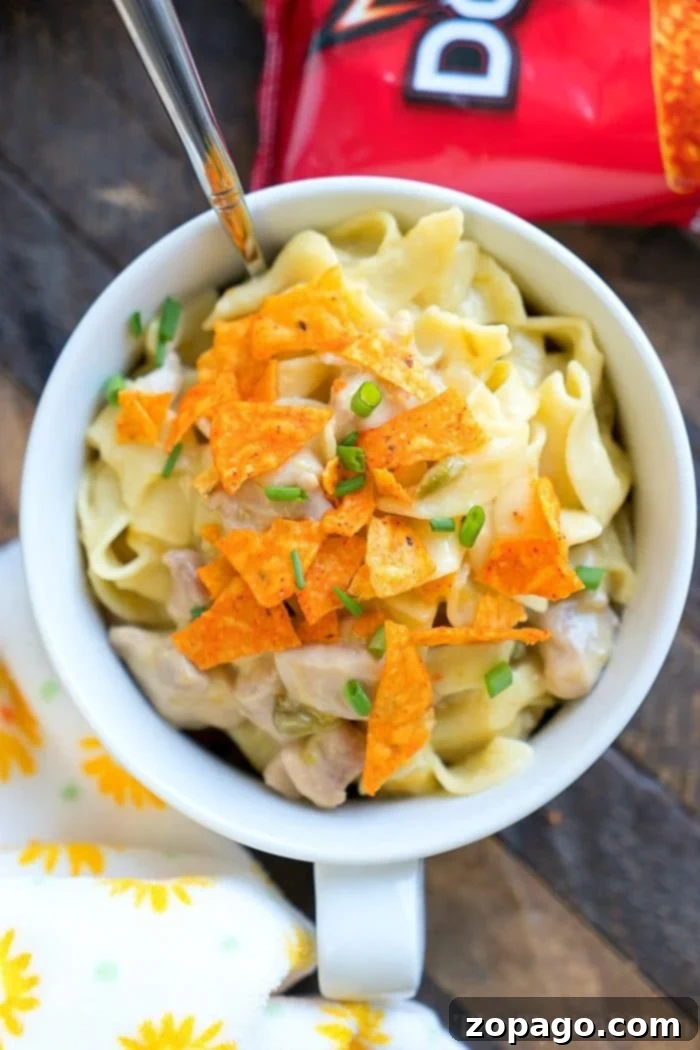 Cheesy Instant Pot Dorito Casserole 2 Creamy Pressure Cooker Dorito Casserole with chicken and egg noodles, topped with crunchy nacho cheese Doritos.
