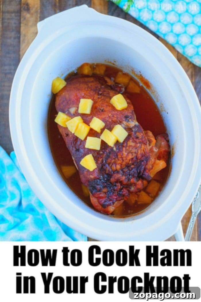 This pineapple crockpot ham recipe is sweet, tender, and delicious. Cooks on it's own in your slow cooker and is ready when you are, perfect for holidays! #crockpot #slowcooker #ham #pineapple #christmas #dinner #easter how to cook ham in your crockpot