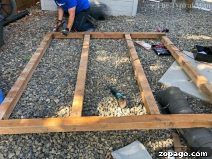 Step-by-step process of constructing an affordable fire pit and seating area in the backyard. Building a custom fire pit and benches, showing the early stages of construction and material preparation.