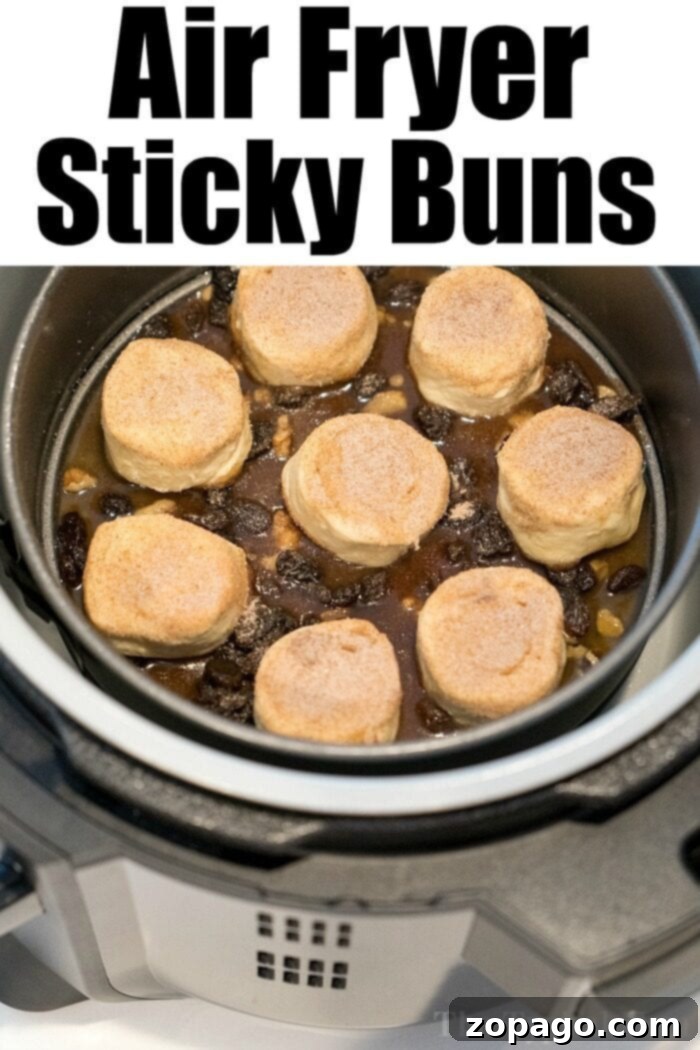 The best air fryer cinnamon rolls ever! I made these Ninja Foodi sticky buns using no yeast in just 20 minutes total and they were the best breakfast! #airfryer #airfryerrecipes #ninjafoodi #ninjafoodirecipes #cinnamonrolls #breakfast #stickybuns #thetypicalmom Air Fryer Cinnamon Rolls with gooey glaze - perfect for breakfast