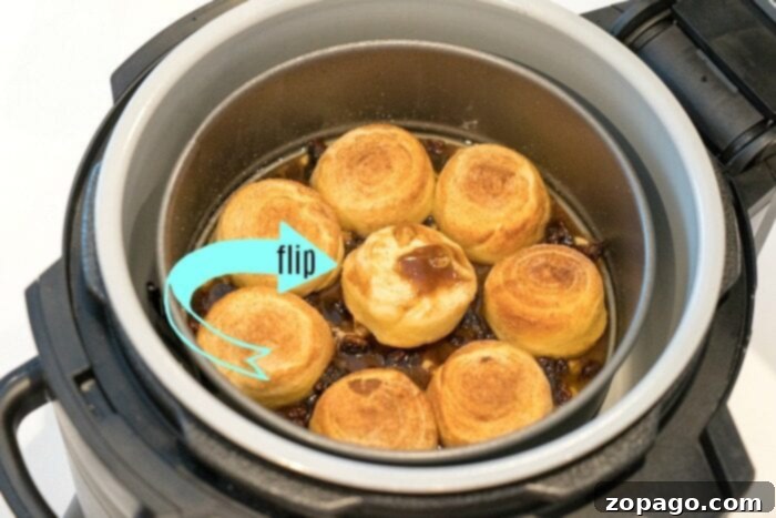 The best air fryer cinnamon rolls ever! I made these Ninja Foodi sticky buns using no yeast in just 20 minutes total and they were the best breakfast! #airfryer #airfryerrecipes #ninjafoodi #ninjafoodirecipes #cinnamonrolls #breakfast #stickybuns #thetypicalmom Air Fryer Sticky Buns with ooey gooey topping and nuts