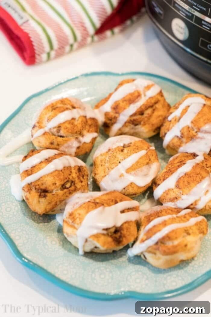 The best air fryer cinnamon rolls ever! I made these Ninja Foodi sticky buns using no yeast in just 20 minutes total and they were the best breakfast! #airfryer #airfryerrecipes #ninjafoodi #ninjafoodirecipes #cinnamonrolls #breakfast #stickybuns #thetypicalmom Ninja Foodi Air Fryer making cinnamon rolls