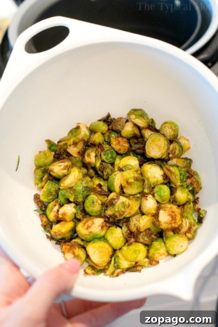 Get Perfectly Crispy Air Fryer Brussels Sprouts Every Time 6 Crispy air fried brussels sprouts ready to serve.
