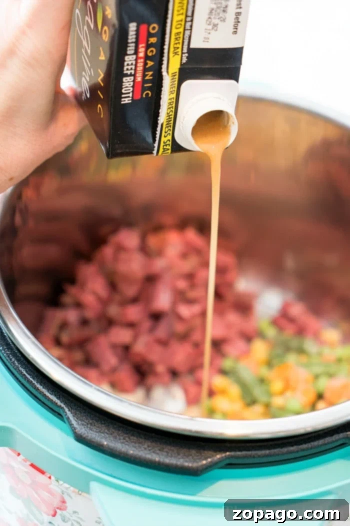 Corned beef soup using your leftover corned beef from St. Patricks Day! Make this chowder in your Instant Pot, Ninja Foodi or on your stovetop tonight! #cornedbeef #leftover #cornedbeefandcabbage #instantpotrecipes #instantpot #ninjafoodirecipes #ninjafoodi #chowder #soup #thetypicalmom Leftover Corned Beef Soup served in a bowl