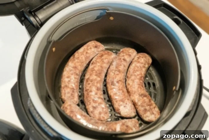 Frozen sausage in the Ninja Foodi or air fryer. Frozen sausage links in an air fryer basket