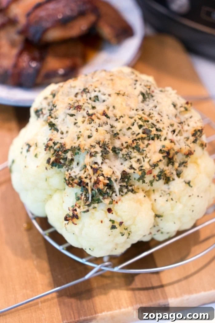 Making pressure cooker cauliflower whole is easy and more delicious than you'd think! NO need to break it apart anymore. In just 10 minutes it's perfect. #pressurecooker #ninjafoodi #cauliflower #wholecauliflower #instantpot #crockpotexpress instant pot cauliflower