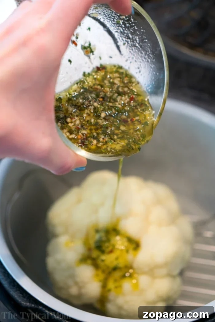 Whole cauliflower in a pressure cooker is easy and more delicious than you'd think! NO need to break it apart anymore. In just 10 minutes it's perfect. #pressurecooker #ninjafoodi #cauliflower #wholecauliflower #instantpot #crockpotexpress whole cauliflower pressure cooker time