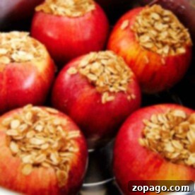 Perfectly Tender Pressure Cooker Apples 4 Six pressure cooker baked apples stuffed with oats and cinnamon in a pot.