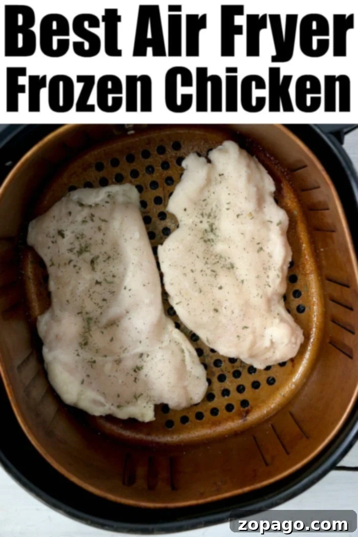 Tender frozen chicken breast in air fryer is so easy to make! Great hack if you forget to defrost your chicken but dinner is just minutes away. Tender, unbreaded chicken breast slices cooked from frozen in an air fryer, garnished with fresh herbs.