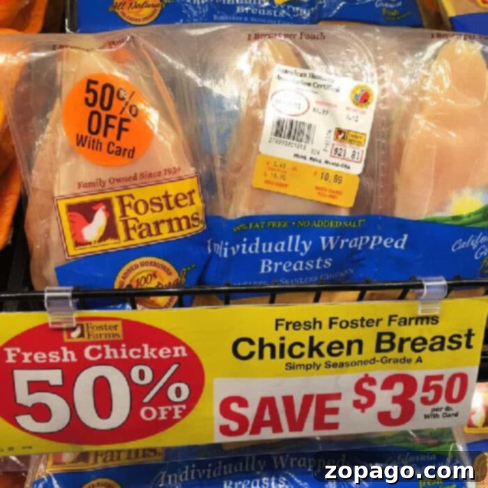 Easy Instant Pot Chicken Parmesan 3 A display of Foster Farms individually wrapped chicken breasts with a discount label showing "50% Off with Card." The yellow sign below reads, "Fresh Foster Farms Chicken Breast, Save $3.50." Perfect for your next Instant Pot chicken parmesan! The packaging features the Foster Farms logo.