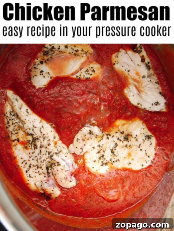 Instant Pot chicken parmesan using fresh chicken breasts is amazing! Tender meat smothered in flavorful tomato sauce and mozzarella cheese. Dinner is here! #instantpot #instantpotrecipes #instantpotchickenparmesan #chickenparmesan #chicken #instantpotchicken #thetypicalmom pressure cooker chicken parmesan no breading