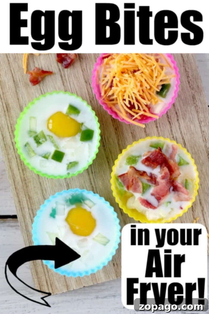 BEST egg bites cooked in your air fryer and filled with bacon, cheese, and onions – an ideal low carb and keto breakfast idea, just like customized Starbucks egg bites! Close up view of perfectly golden brown air fryer egg bites in a silicone mold.