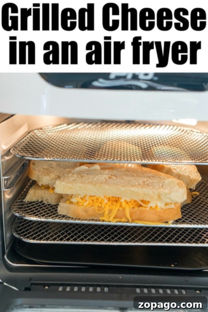 Air Fryer Grilled Cheese Perfection 5 Three golden brown grilled cheese sandwiches, perfectly toasted and stacked, made in an air fryer.