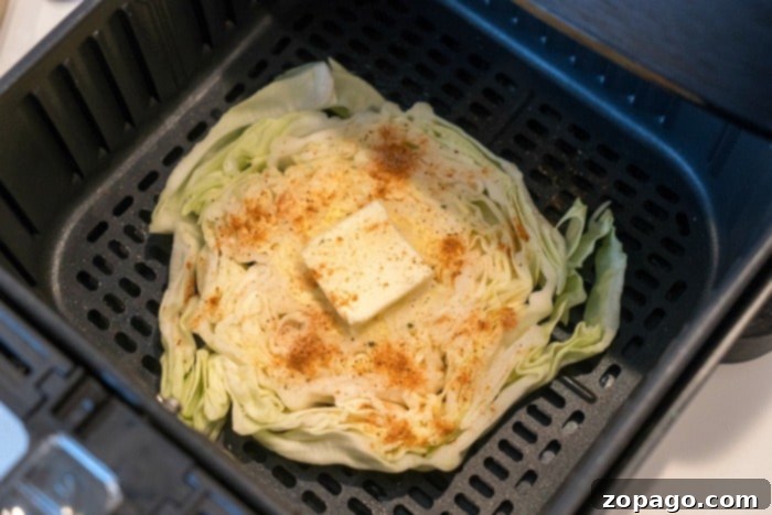 Crispy Air Fryer Cabbage 7 Ninja Foodi air fryer with cooked cabbage slices