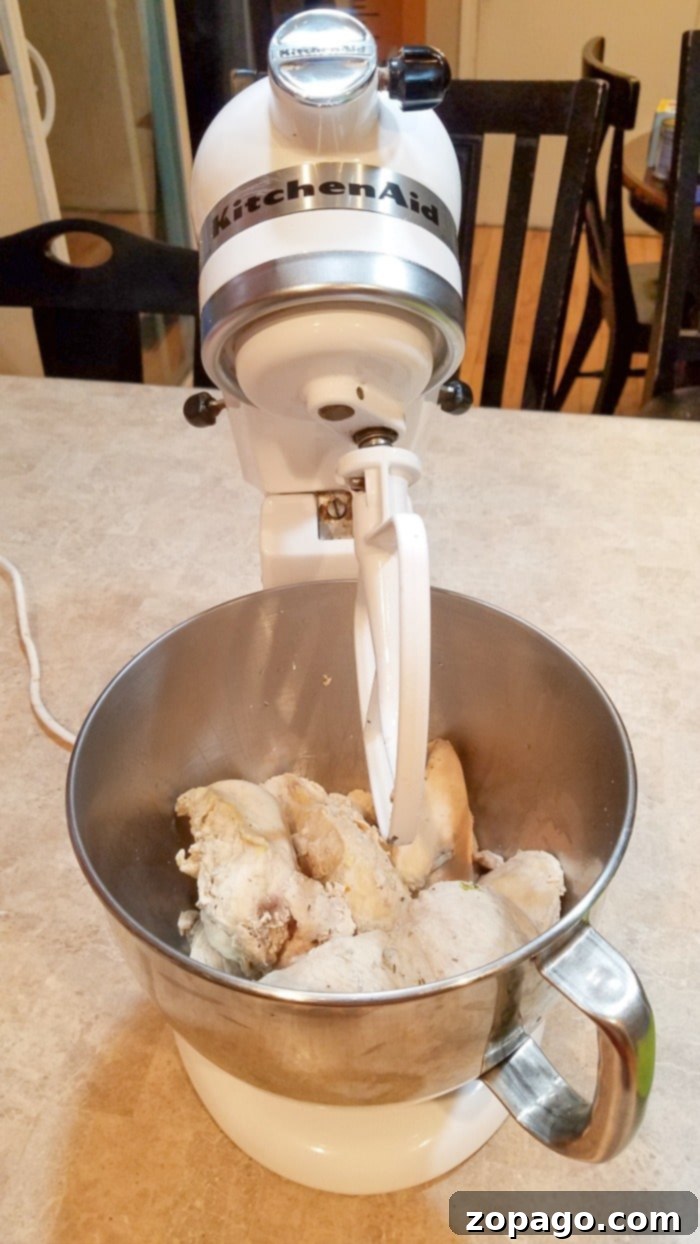 How to make boiled shredded chicken for tacos or on top of buns with bbq sauce! Great technique for batch cooking chicken in large amounts and freezing. how to make shredded chicken