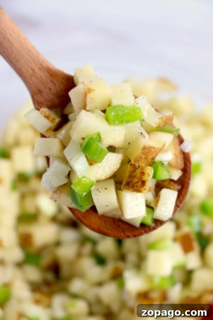 Air fryer diced potatoes with bell peppers topped with cheese are great with eggs, or make breakfast for dinner some night! Cheap and full of flavor. breakfast potatoes