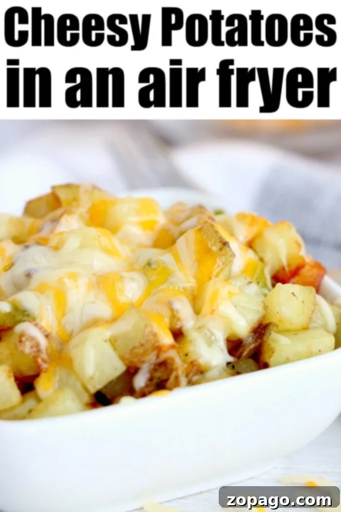 Cheesy air fryer breakfast potatoes with bell peppers topped with cheese are great with eggs, or make breakfast for dinner some night! Cheap and full of flavor. cheesy potato recipe