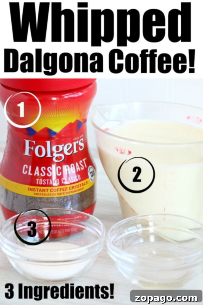 3 ingredient trendy Dalgona whipped coffee recipe! EASY to make this popular TikTok drink everyone is going crazy over. I bet you'll love it too. The three essential ingredients for Dalgona whipped coffee laid out: a jar of Folgers instant coffee, a carton of milk, and two small bowls containing instant coffee and sugar, ready for preparation.