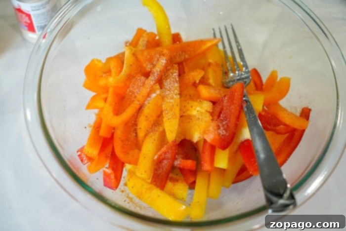 Air-Fried Bell Peppers: Quick, Easy, and Flavorful 5 Beautifully sliced red, yellow, and orange bell peppers, perfectly prepped for air frying.