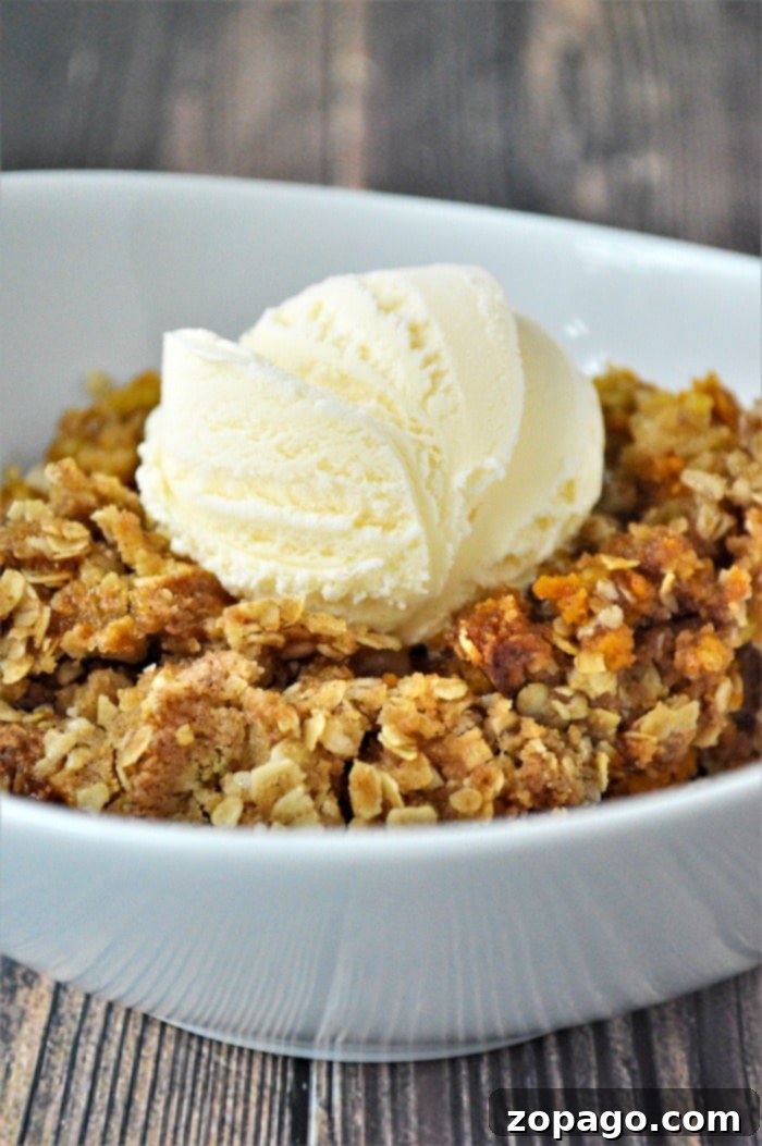 Scratch-Made Pumpkin Crisp 6 A full baking dish of golden-brown pumpkin crisp, ready to be served, perfect for Fall gatherings.