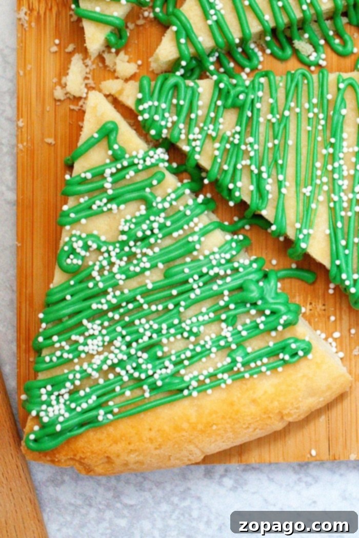 No-Bake Christmas Tree Cookies 2 Christmas Tree Sugar Cookies - perfectly decorated with green icing and sprinkles, ready for the holidays.