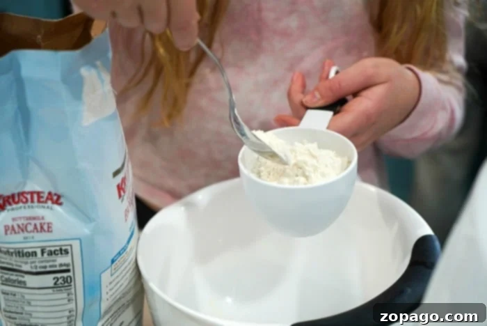 Air Fryer Pancake Perfection 5 Mixing pancake batter for making air fryer pancakes