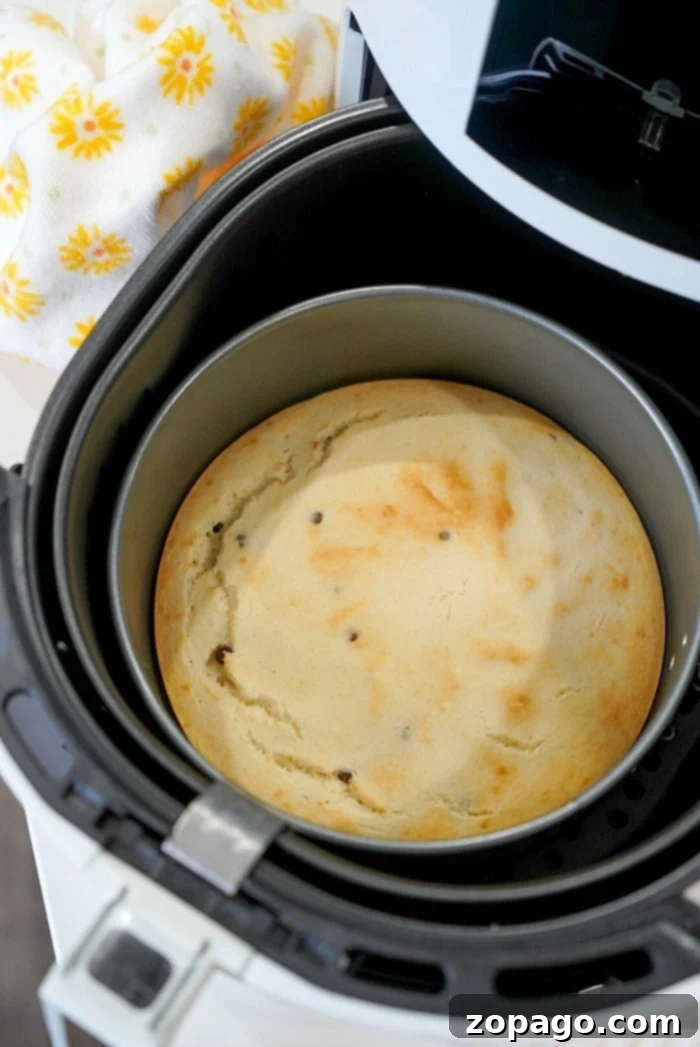 Air Fryer Pancake Perfection 7 A stack of golden air fryer pancakes drizzled with sweet syrup